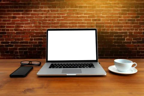 Laptop with blank screen on table. Workspace background new project on laptop Stock Photos