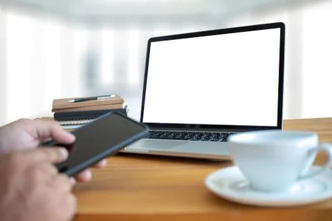 Laptop with blank screen on table. Workspace background new project on laptop 写真素材