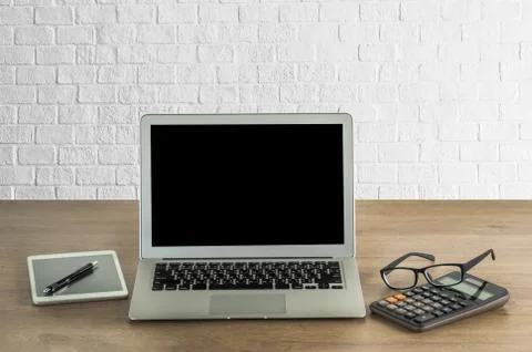 Laptop with blank screen on table. Workspace background new project on laptop Stock Photos