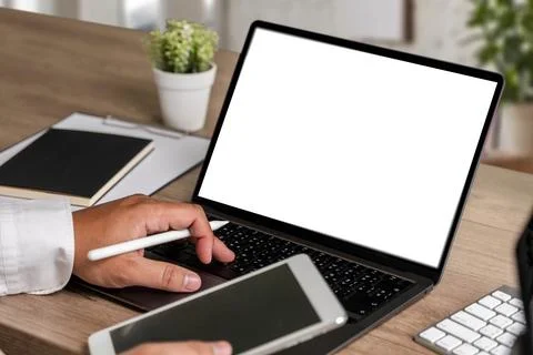Laptop with blank screen on table. Workspace background new project on lapt.. Stock Photos