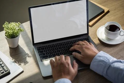 Laptop with blank screen on table. Workspace background new project on lapt.. Stock Photos