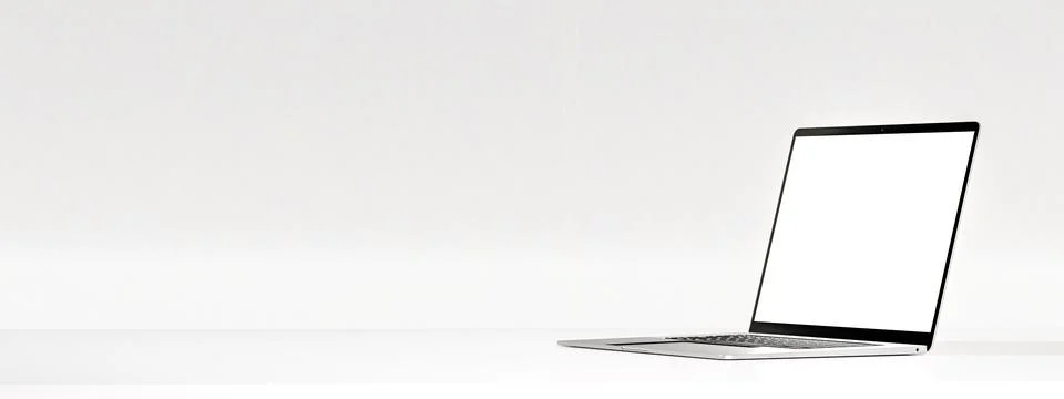 Laptop with blank screen on white table on white wall. Laptop side view posit Illustrazione stock