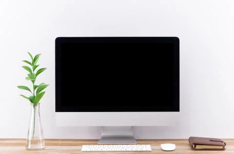 Laptop with blank screen on white table with mouse and smartphone. Home inter Stock Photos