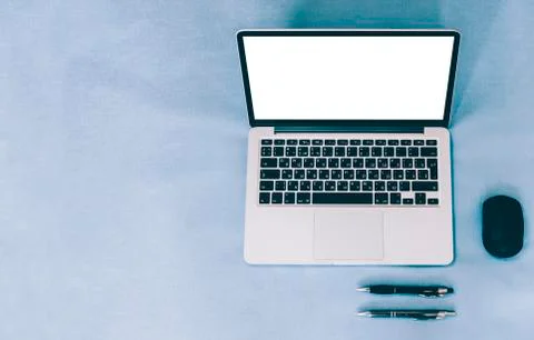 Laptop On Blue Table Stock Photos