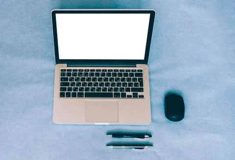 Laptop On Blue Table Stock Photos