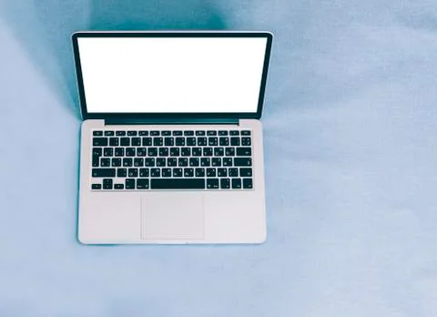 Laptop On Blue Table Stock Photos