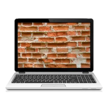 Laptop with brick wall Stock Photos
