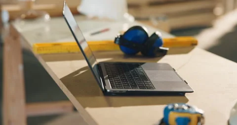Laptop, carpentry and workshop with equipment on desk, furniture manufacturing Stock Footage 341399205