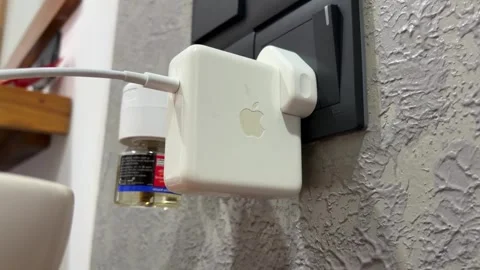 Laptop Charger Plug Connected to Wall Socket Power Adapter Close Up Stock Footage 333862734