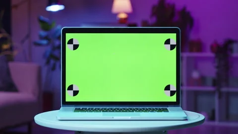 Laptop with chroma key close-up. Compuner monitor with green screen on living Stock Footage 169550300