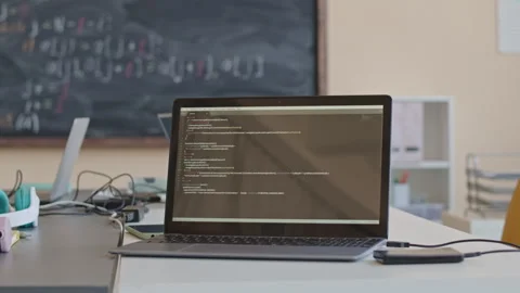 Laptop with Code on Screen in School Classroom 動画素材 257059168