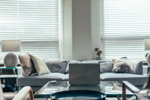 Laptop on the coffee table in front of the sofa 写真素材