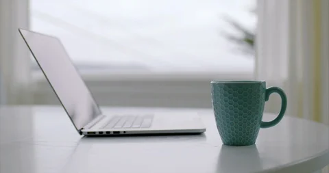 Laptop computer and coffee cup on a desk. Stock Footage 88370285