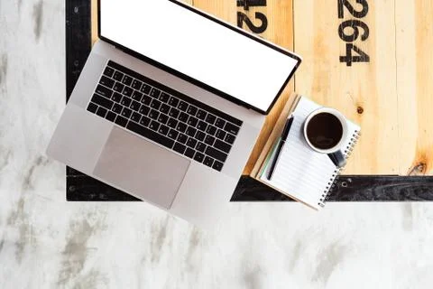 Laptop computer and coffee on table top view Stock Photos
