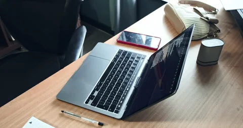 Laptop, computer, and device on table or desk. Home office, room and workspace. Stock Footage 317107575