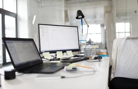 Laptop computer and gadgets on table at office Foto stock