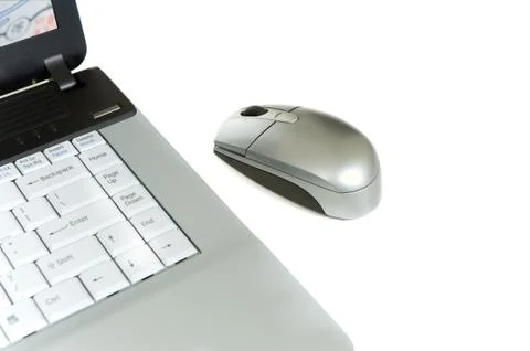 Laptop computer and mouse Stock Photos
