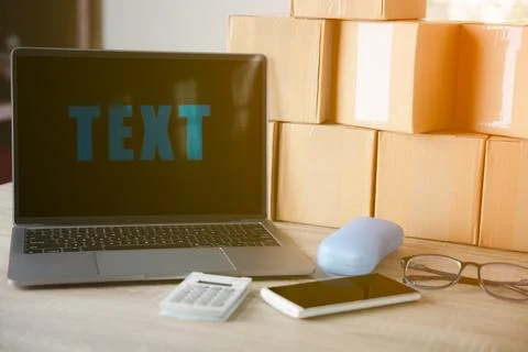Laptop computer And packing boxes Stock Photos