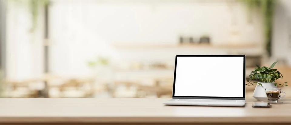 A laptop computer and a presentation space on a wooden table in a cosy, con.. Stock Illustration