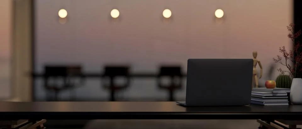 A laptop computer on a black table in a modern, luxurious meeting room at s.. Stock-Illustration