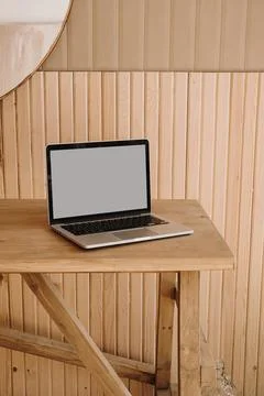 Laptop computer with blank copy space screen on wooden table. Minimal aesthet Stock Photos