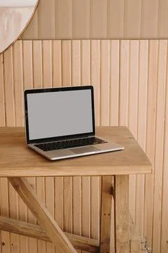 Laptop computer with blank copy space screen. Minimalist home office desk wor Stock Photos