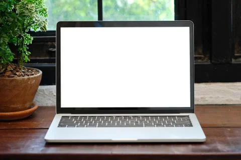 Laptop computer with blank screen for mock up template background, business t Stock Photos