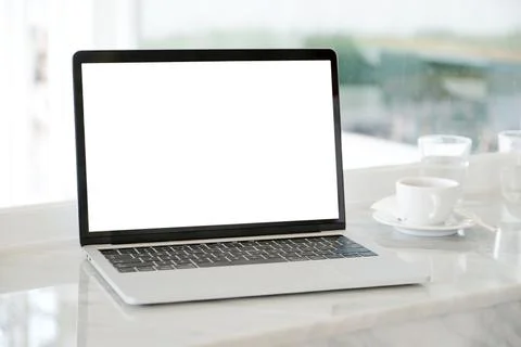 Laptop computer with blank screen for mock up template background, business t Stock Photos