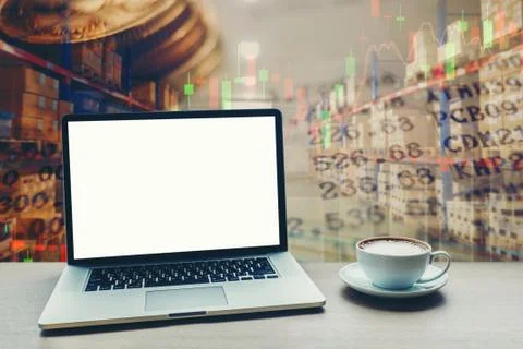 Laptop computer with blank white screen on table finance concept on backgroun Foto stock