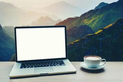 Laptop computer with blank white screen on table Stock Photos