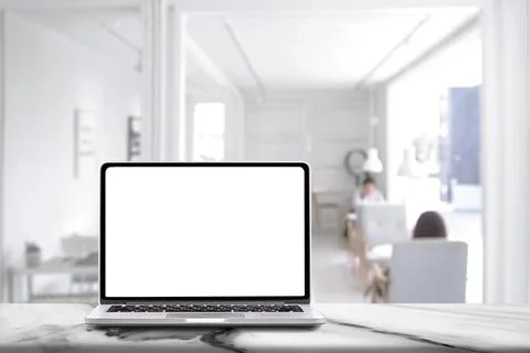 Laptop computer with blank white screen on marble table with modern workpla.. 스톡 사진