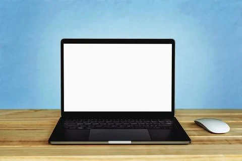 Laptop computer with blank white screen on the table, background wall blur Stock Photos