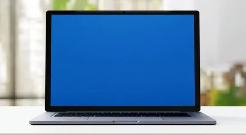 Laptop computer blue screen in office working space mockup, 3d rendering Stock Photos