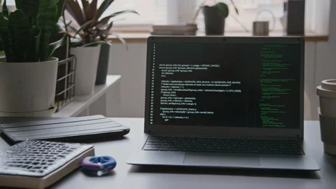 Laptop with Computer Code on Desk of IT Engineer in Office Stock Footage 285713511