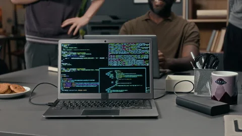 Laptop with Computer Code, Plate of Cookies, Pen Holder and Portable Hard Drive Vidéo 329610727