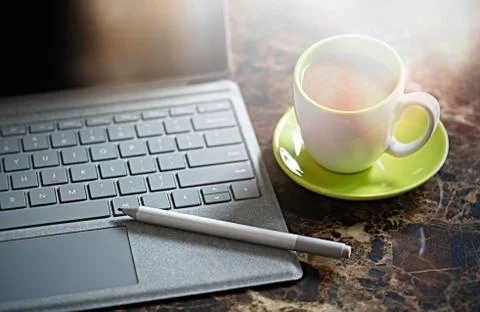Laptop computer , coffee, old 35 film camera Stock Photos