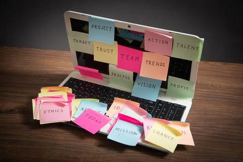 Laptop computer with colorful sticky notes. Business Foto stock