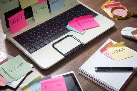 Laptop computer with colorful sticky notes. Business Foto stock