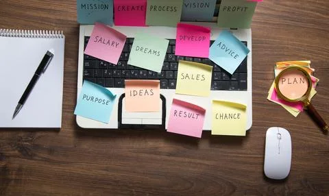 Laptop computer with colorful sticky notes. Business Foto stock
