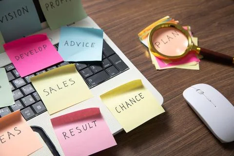 Laptop computer with colorful sticky notes. Business Foto stock