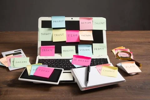 Laptop computer with colorful sticky notes. Business Foto stock