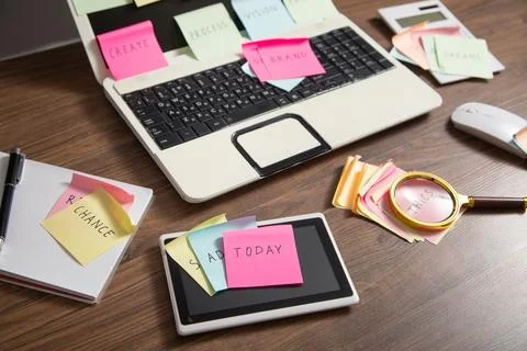 Laptop computer with colorful sticky notes. Business Foto stock
