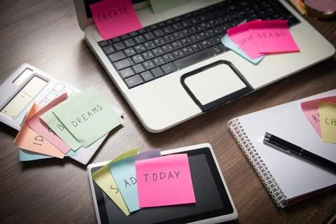 Laptop computer with colorful sticky notes. Business Foto stock