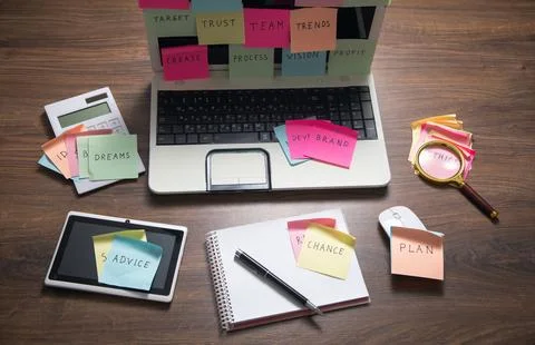 Laptop computer with colorful sticky notes. Business Foto stock