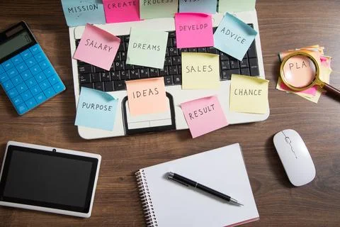 Laptop computer with colorful sticky notes. Business Foto stock