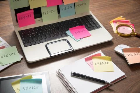 Laptop computer with colorful sticky notes. Business Foto stock