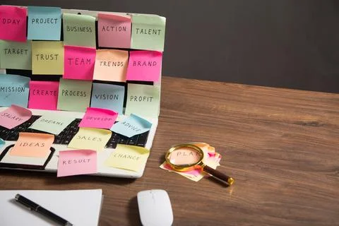 Laptop computer with colorful sticky notes. Business Foto stock