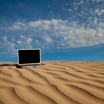 Laptop computer on desert sand Foto stock