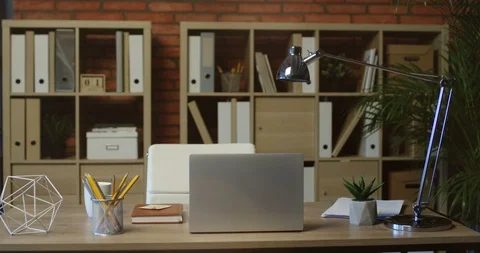 Laptop computer on the desk of the nice office room. Interior of the working Stock-Footage 104984911
