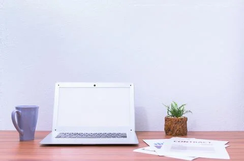 Laptop computer is at the desk Stock Photos
